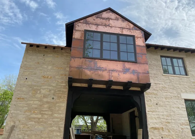 Copper metal panel facade on a stone building for Skylight Installation in Fort Pierce