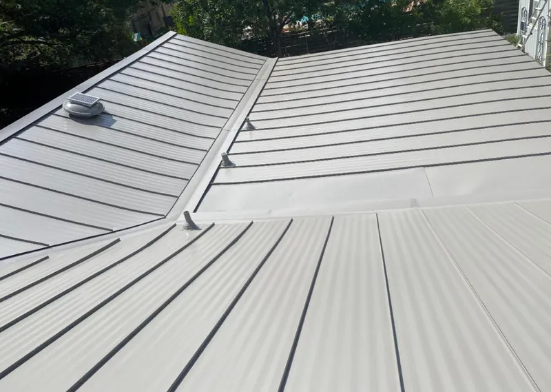 Solar attic fan installed on a metal roof for Roof Ventilation in Fort Pierce